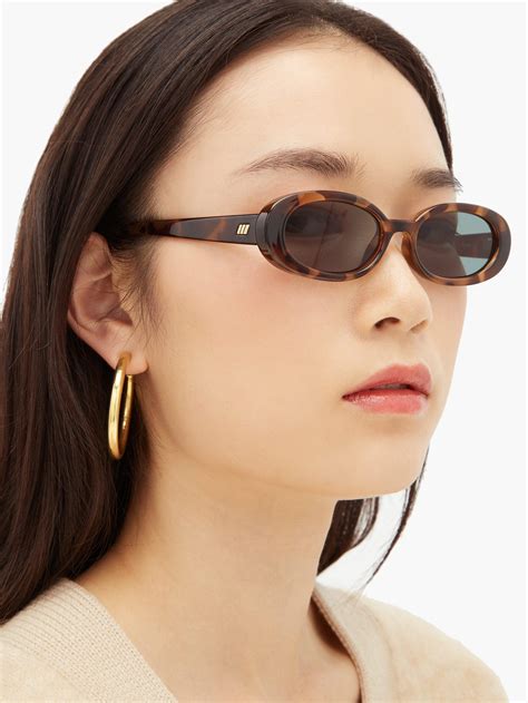 Le Specs Outta Love Oval Tortoiseshell Acetate Sunglasses In Brown Lyst