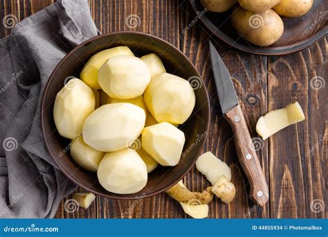 Peeled Potatoes In A Glass Bowl Royalty Free Stock Photo