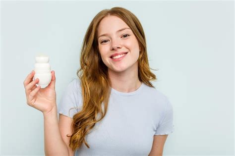 Premium Photo Young Caucasian Woman Holding Deodorant Isolated On