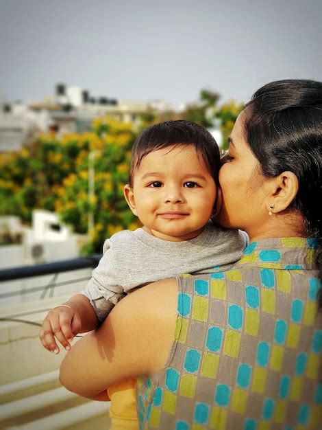 Premium Photo Portrait Of Son With Mother Standing Outdoors