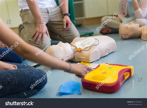 First Aid Cardiopulmonary Resuscitation Course Using Stock Photo