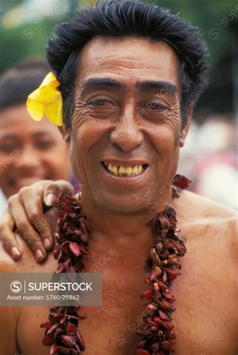 Samoa Portrait Of Older Samoan Man Smiling With Flower In Ear No Model