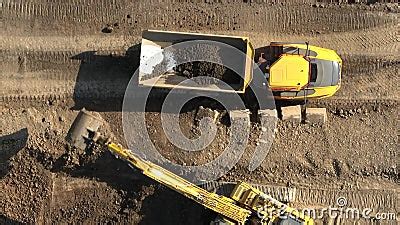 Tipper Truck Being Loaded Up With Earth By A Digger Stock Footage