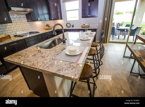 Granite Counter Kitchen Island With Place Settings Stock Photo - Alamy