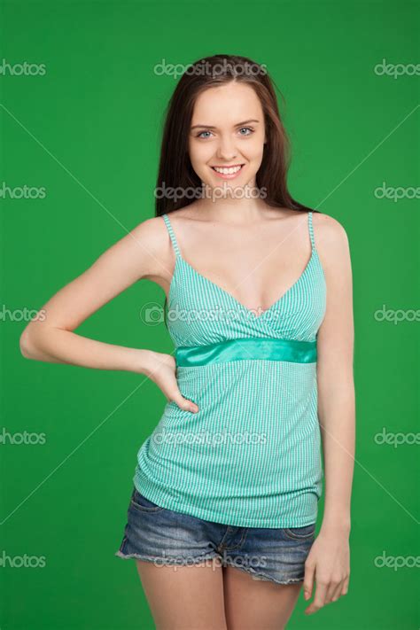 Portrait Of Beautiful Smiling Brunette Girl Wearing Shorts Over Stock