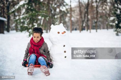 Snowman Sledding Photos And Premium High Res Pictures Getty Images