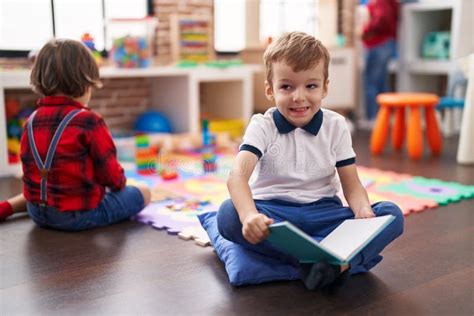 Two Kids Reading Book Sitting on Floor at Kindergarten Stock Image - Image of children, book ...