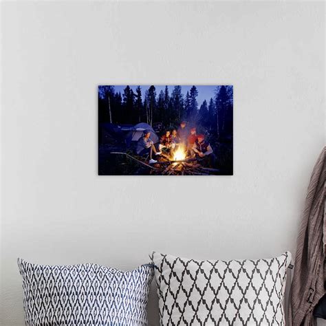 Group Of People Sitting By Campfire Wall Art Canvas Prints Framed