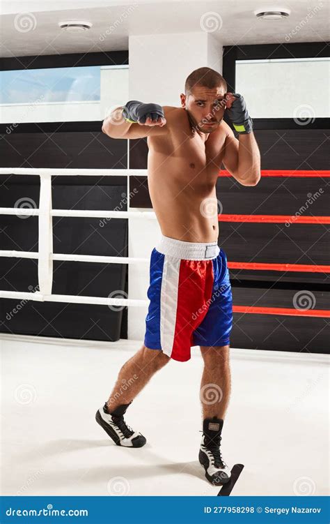 Boxer In Blue Gloves Warming Up In The Gym Stock Photo Image Of