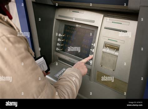 Person Using Cash Dispenser Stock Photo Alamy