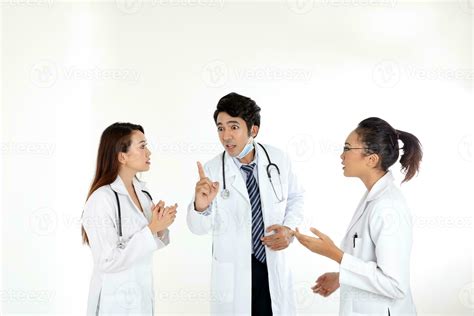 Asian Malay Chinese male female three doctors talking discussing