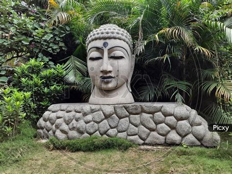 Image Of Beautiful Big Size Stone Lord Buddha Statue Located In The Park For People Attraction