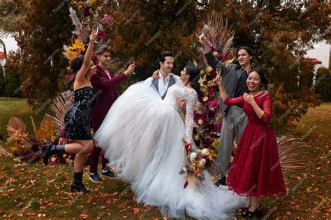 Premium Photo Full Shot Groom Holding Bride