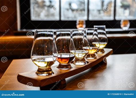 Flight Of Scottish Whisky Tasting Glasses With Variety Of Single Malts