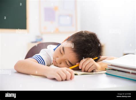 Primary School Boy In The Classroom Stock Photo Alamy