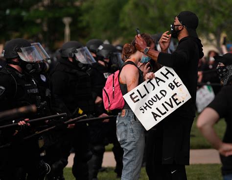 Police Officers On Leave After Photographed Near Elijah McClain's Death ...