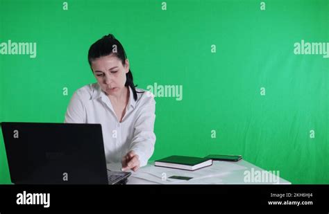 Woman Manager Working In The Office At A Laptop Green Screen