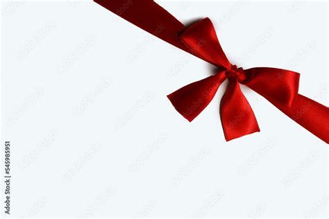 Red ribbon bow isolated on white Stock Photo | Adobe Stock