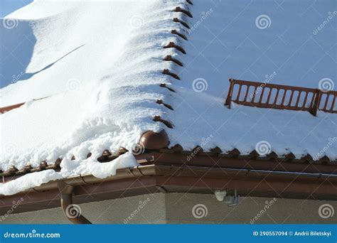 Snow Guard For Safety In Winter On House Roof Top Covered With Ceramic Shingles Tiled Covering