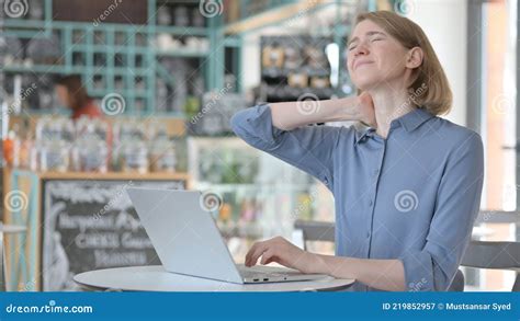 Young Woman Having Neck Pain While Typing On Laptop Stock Image Image