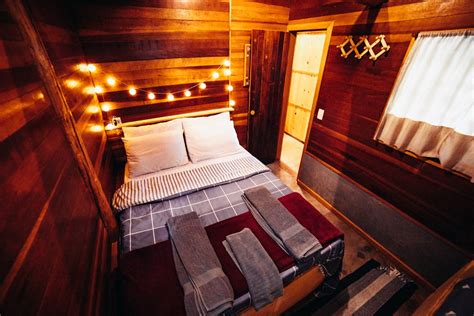 A Bedroom in a Wooden Cabin · Free Stock Photo