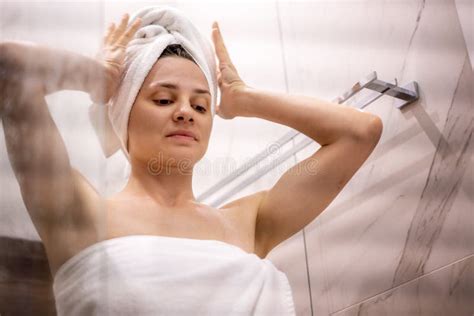 Young Beautiful Woman After Taking A Shower Standing In The Bathroom