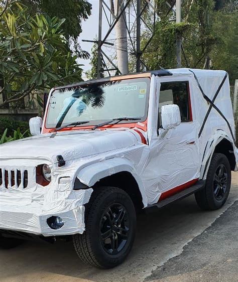 Red 2020 Mahindra Thar with all the production elements spied