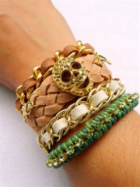 The Bracelets Are Decorated With Gold Chains And Skulls On Each One