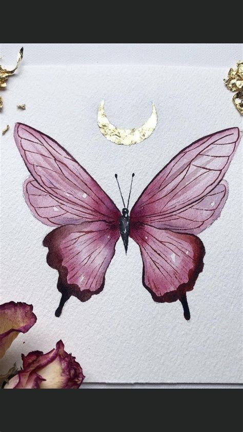 A Pink Butterfly Sitting On Top Of A Piece Of Paper Next To Some Dried