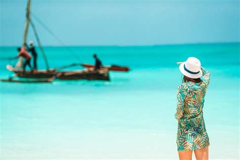 Premium Photo Rear View Of Woman Standing Against Sea