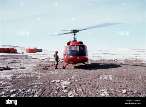 Front view of a UH-1 Iroquois Huey helicopter being fueled at McMurdo Sound prior to flying Vice ...