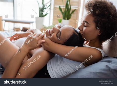 Lesbian African American Woman Kissing Head Stock Photo