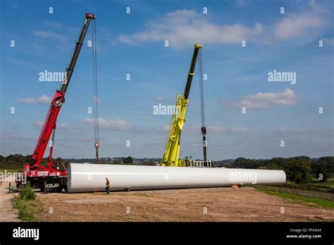 Wind Turbine Installation A Workman Secure The Crane Fixtures Ready To