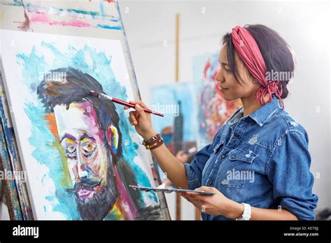 Female artist painting in art studio Stock Photo - Alamy