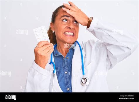 Middle Age Mature Doctor Woman Showing Prescription Pills Over Isolated Background Stressed With