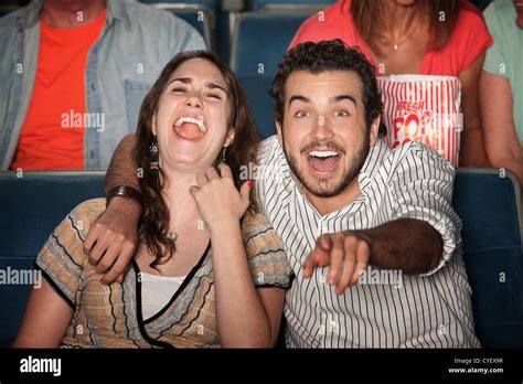 Caucasian Couple Laugh Out Loud In Theater Stock Photo Alamy