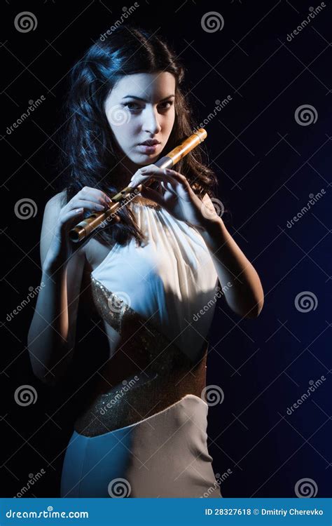 Sensuality Brunette Plays A Wooden Flute Stock Photo Image Of
