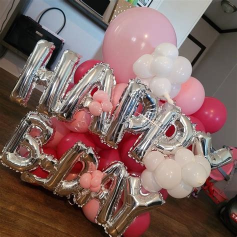 balloons and helium letters spelling out the word love