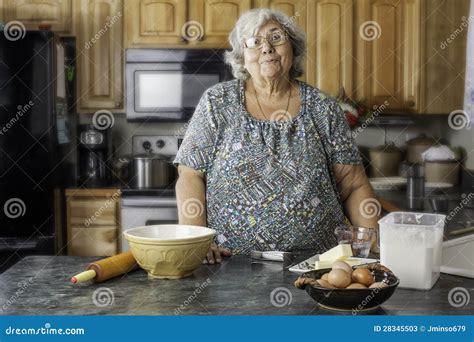 Grandma in a Kitchen Preparing To Bake Stock Image - Image of casual ...