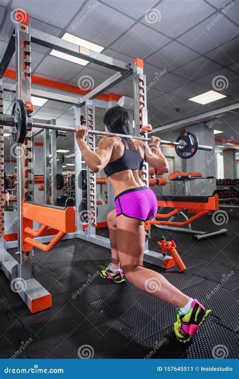 Athletic Brunette Doing Barbell Squats In The Gym Beautiful Woman Getting Ready For