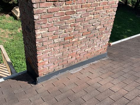 Residential Shingle Roof With Leaking Chimney And Soffit Sagging In