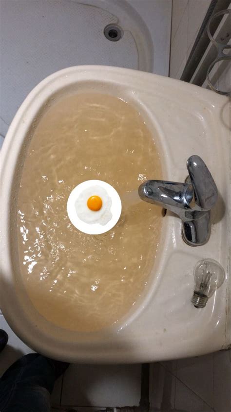 A Sink That Has An Egg In It