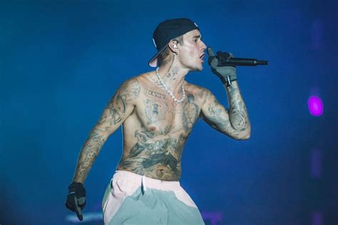 Justin Biebers Tattoos And Meanings Popsugar Beauty