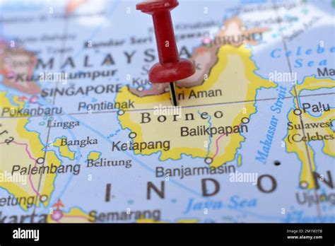 Red Push Pin Pointing On Location Of Borneo World Map Close Up View