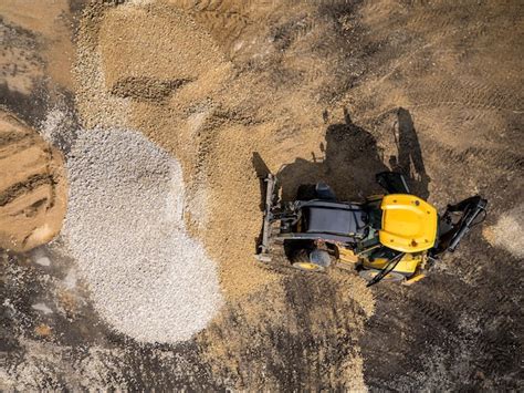 Premium Photo | Wheeled loader in action at a road construction site