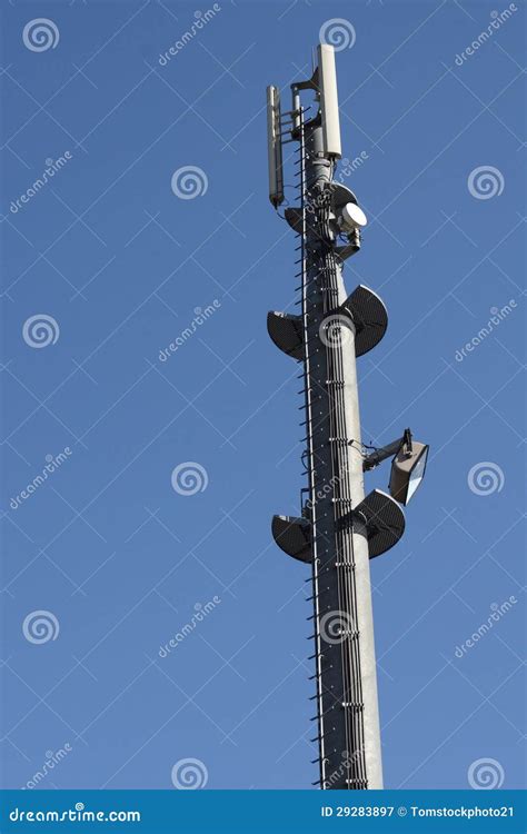 Telecommunication Microwave Antenna Dish On A Building Rooftop With The