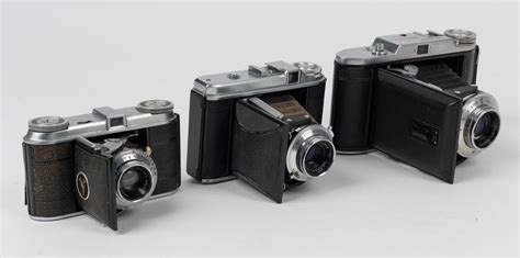 At Auction VOIGTLÄNDER Three vertical folding cameras one 1948 Vito