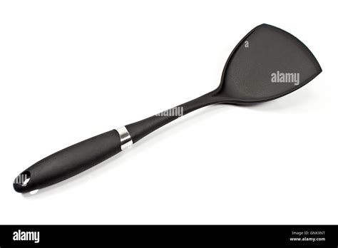 Black plastic kitchen spatula isolated on white Stock Photo - Alamy