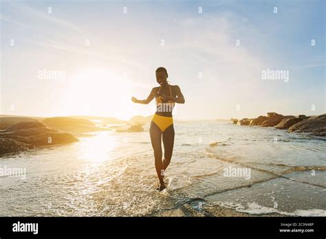 Beautiful African Woman In Yellow Bikini Dancing And Enjoying On The