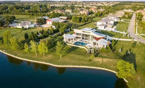 Contemporary Kansas Home With Golf Simulator Infinity Pool